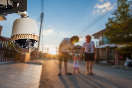 CCTV Camera Operating with family in background of village